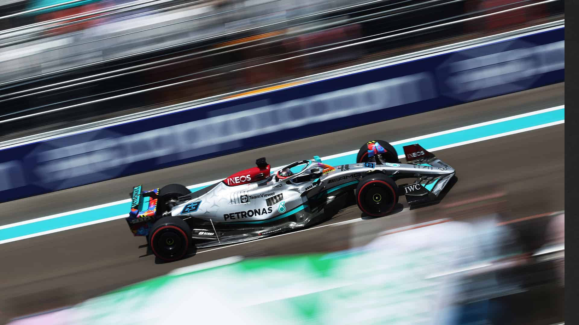 Own The Track With The Mercedes F1 Iphone Background