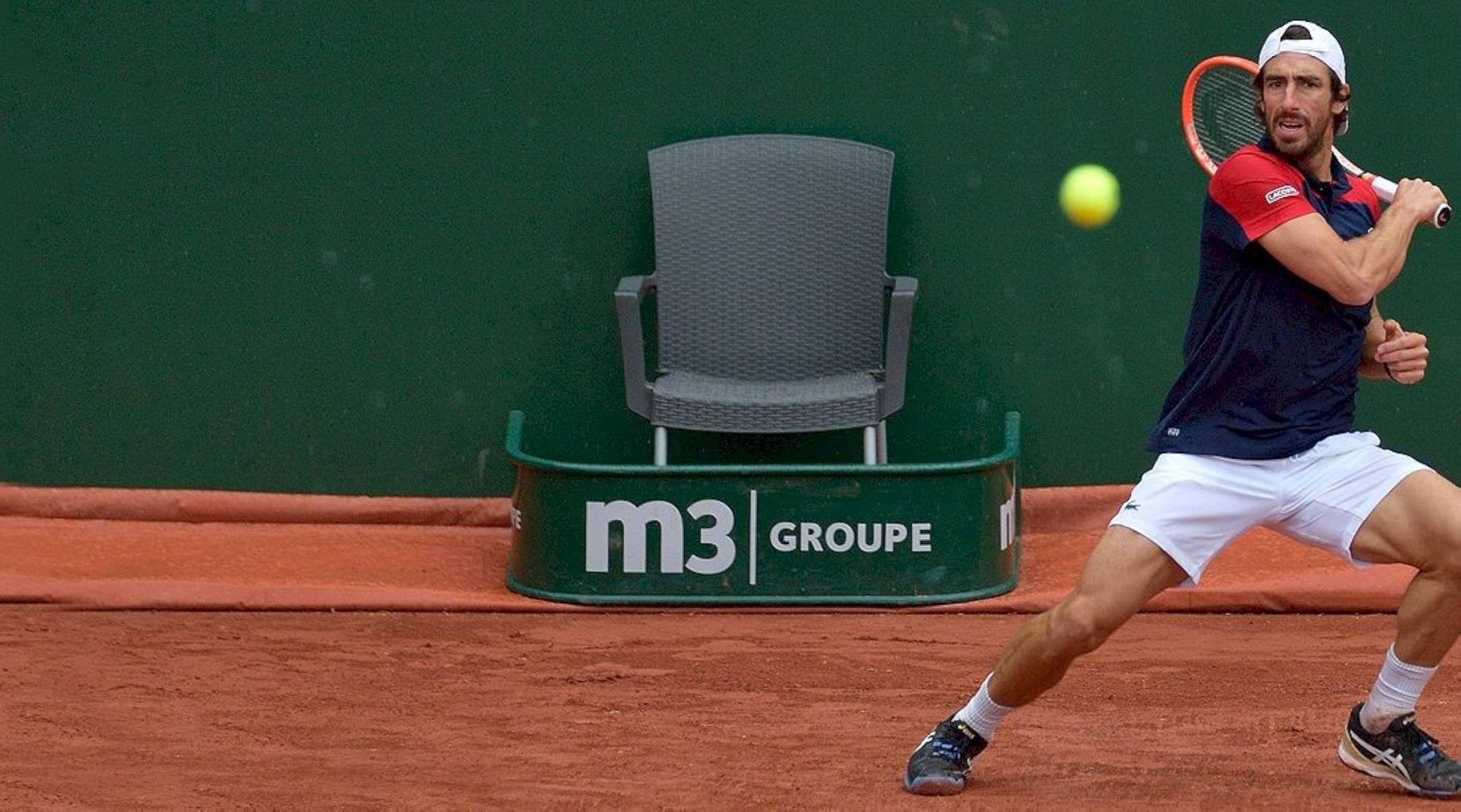 Pablo Cuevas Hitting Tennis Ball Background