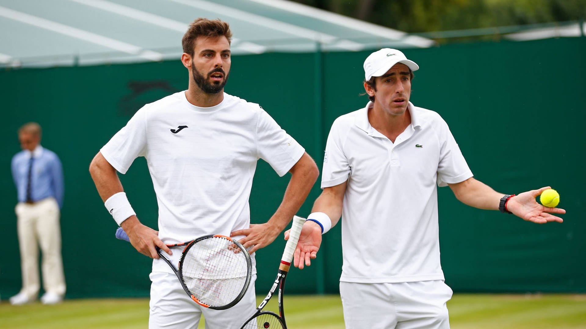 Pablo Cuevas Looking Confused With Marcel Granollers Background