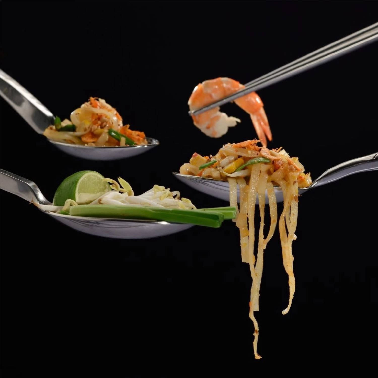 Pad Thai Ingredients On Spoons And Chopsticks