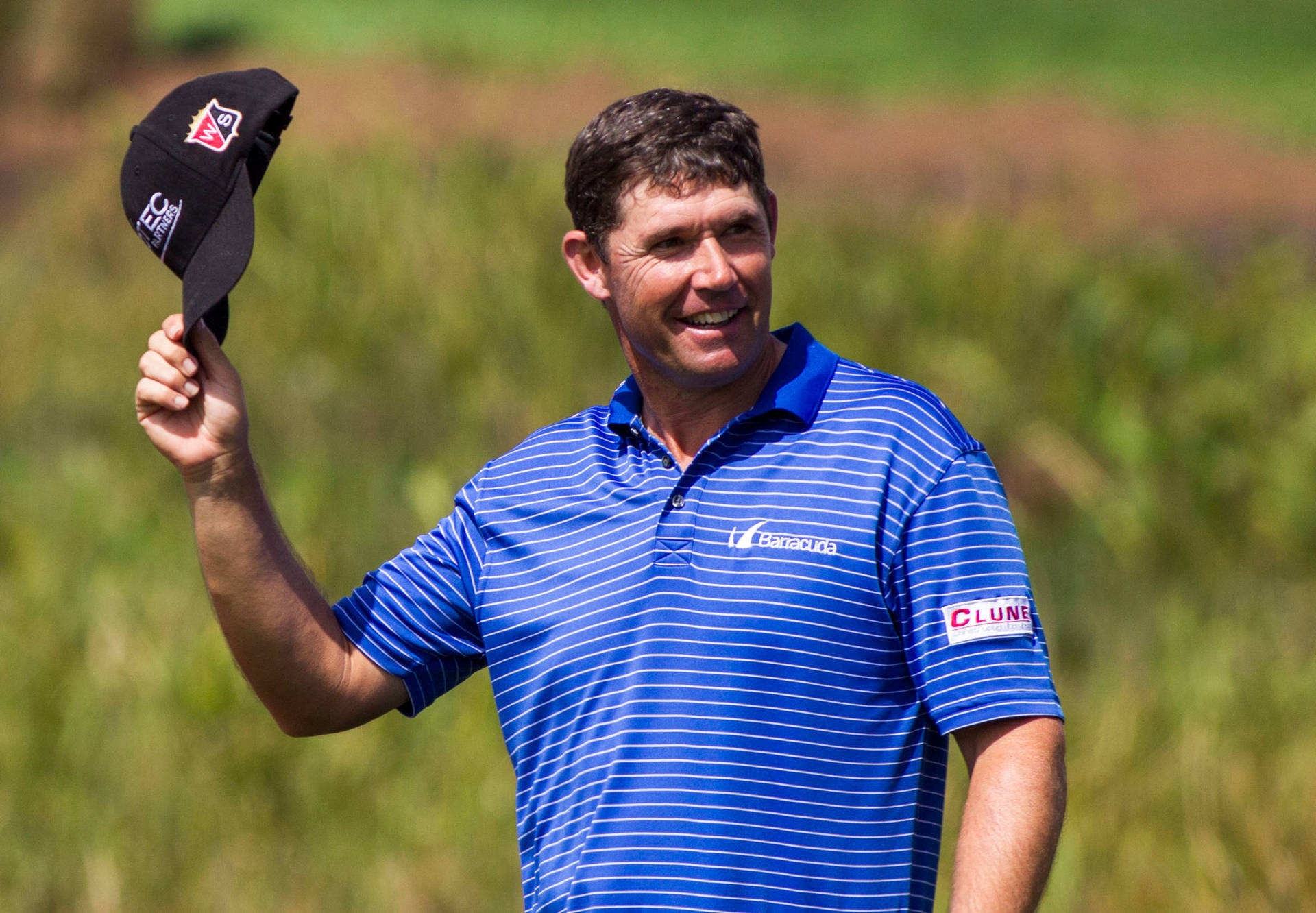 Padraig Harrington Celebrating A Successful Shot On The Golf Course Background