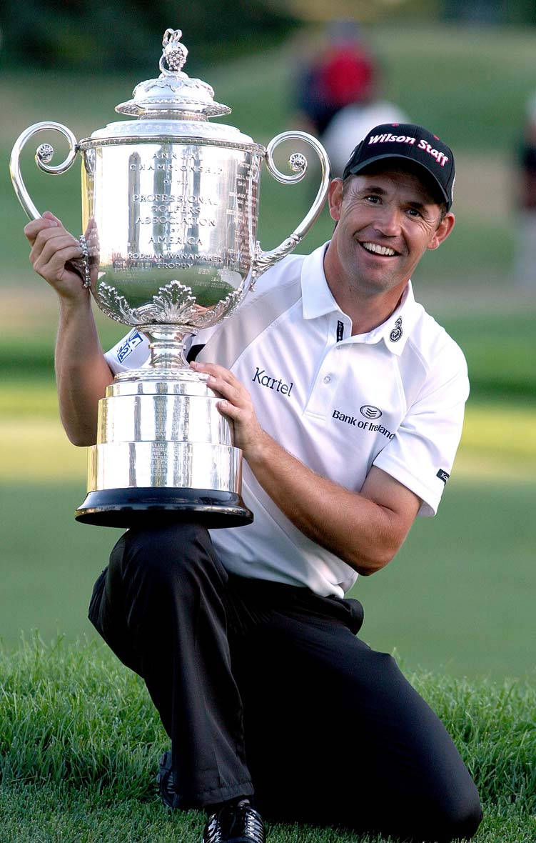 Padraig Harrington Holding Giant Trophy Background