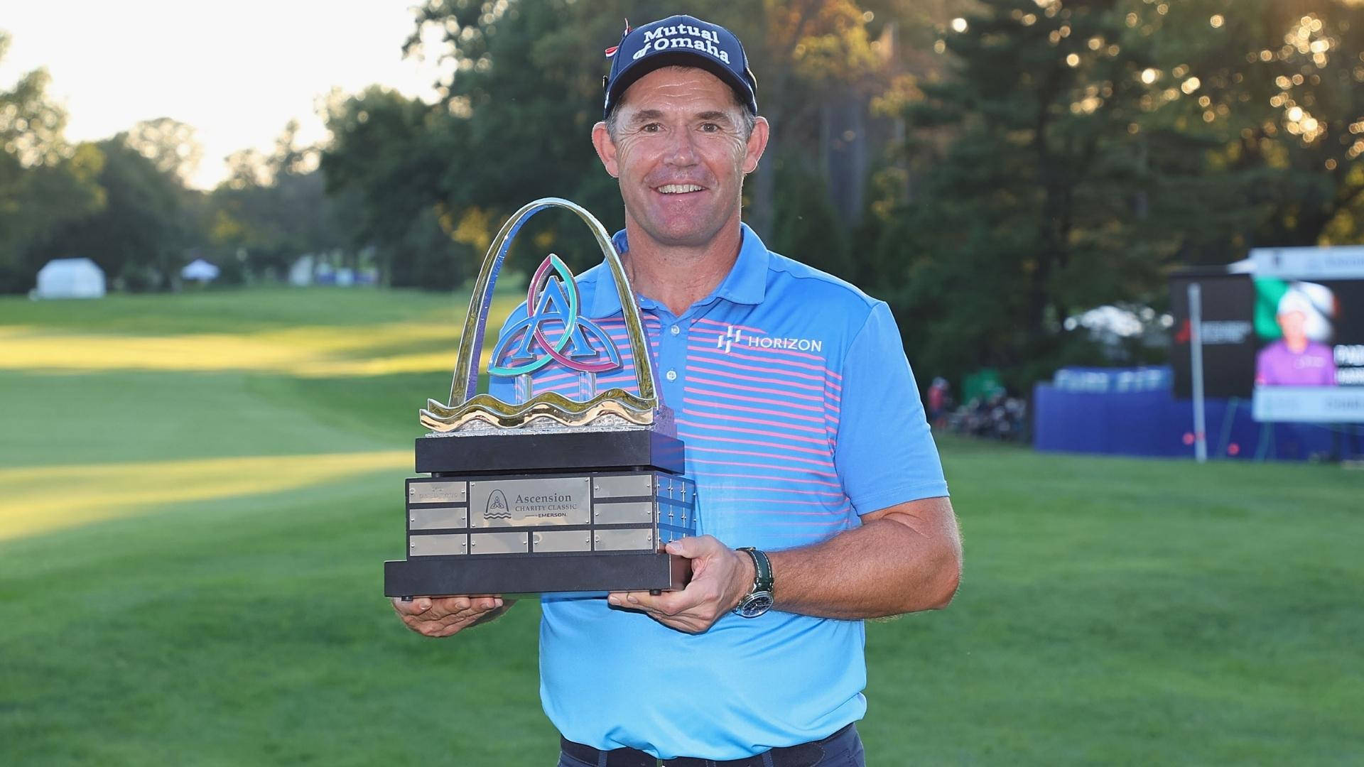 Padraig Harrington Posing With Trophy Background