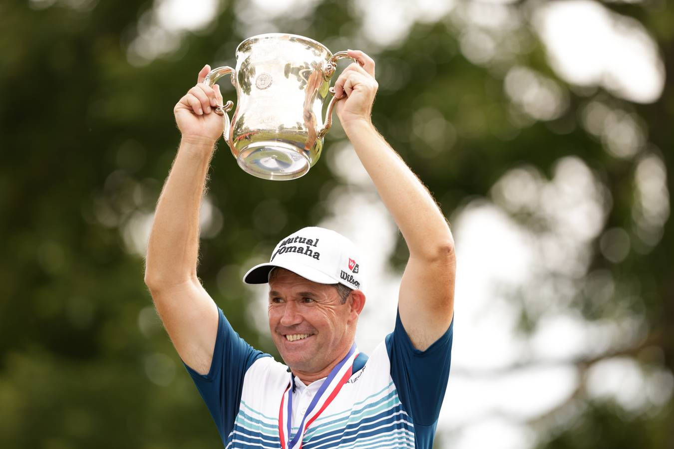 Padraig Harrington Raising Trophy Background