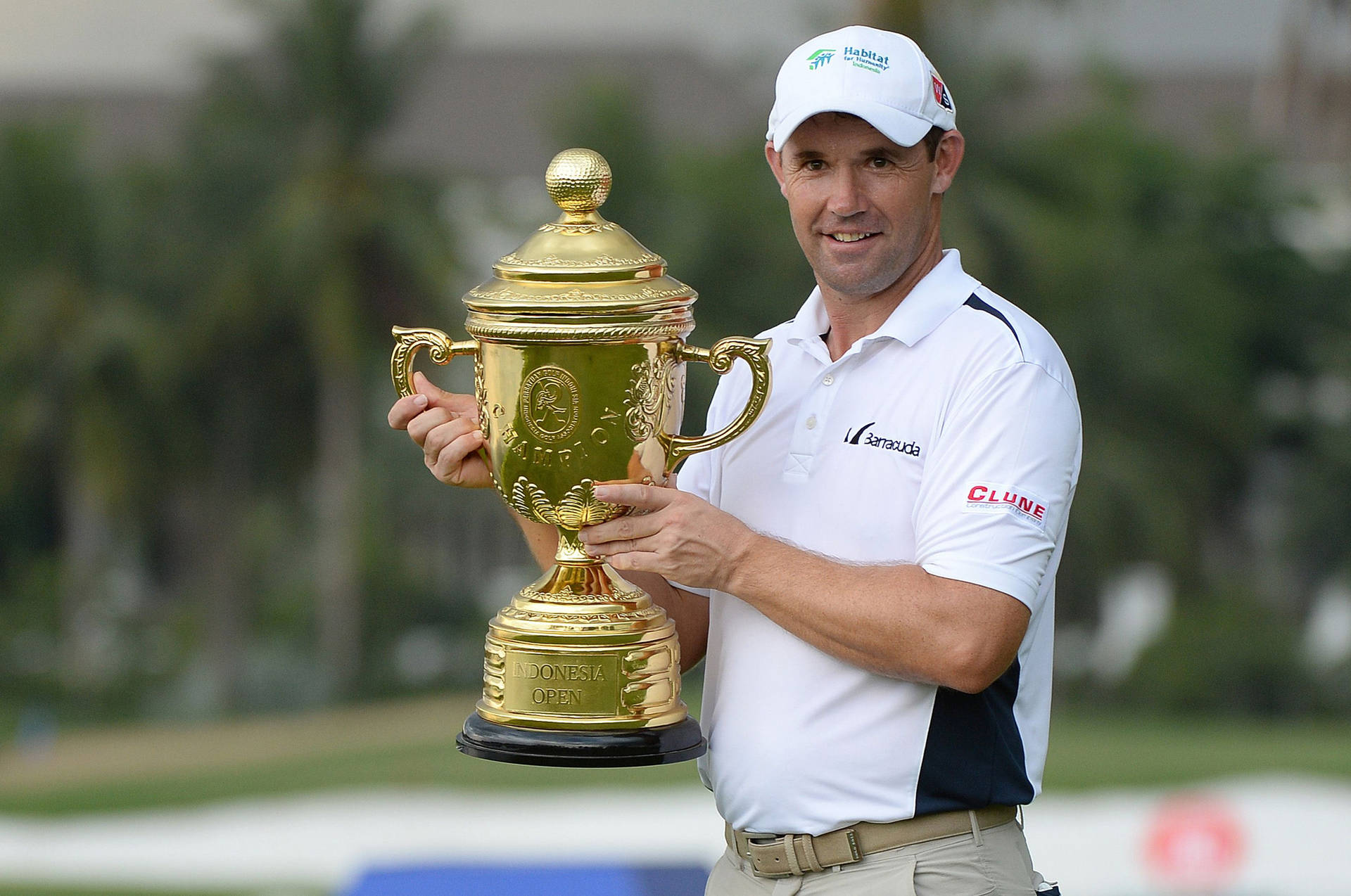 Padraig Harrington Showcasing Trophy Background