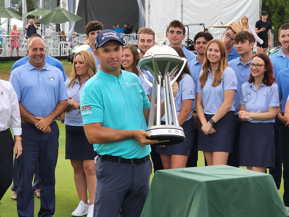 Padraig Harrington Showing His Trophy Background