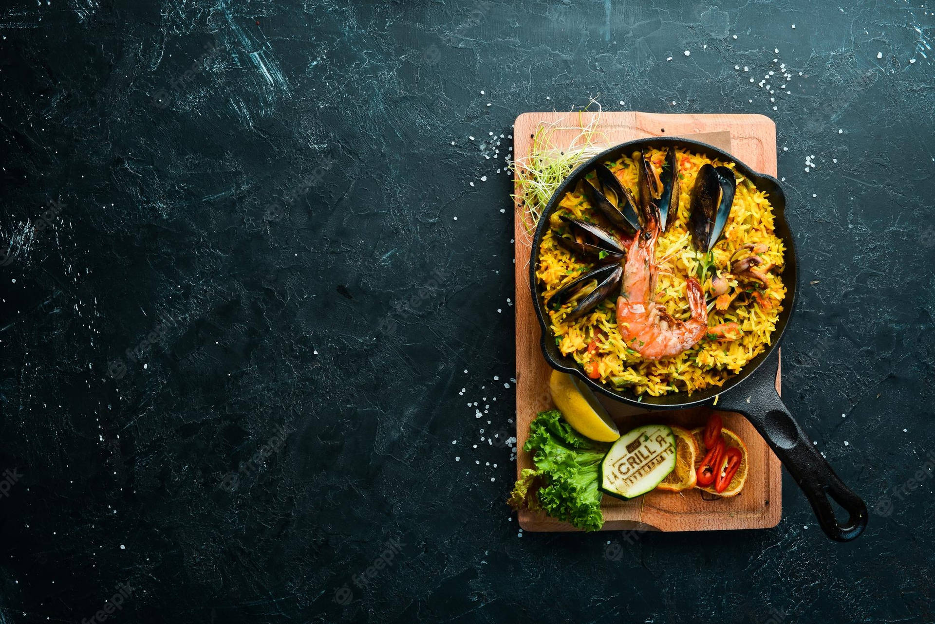 Paella Dish With Veggies On Board Background