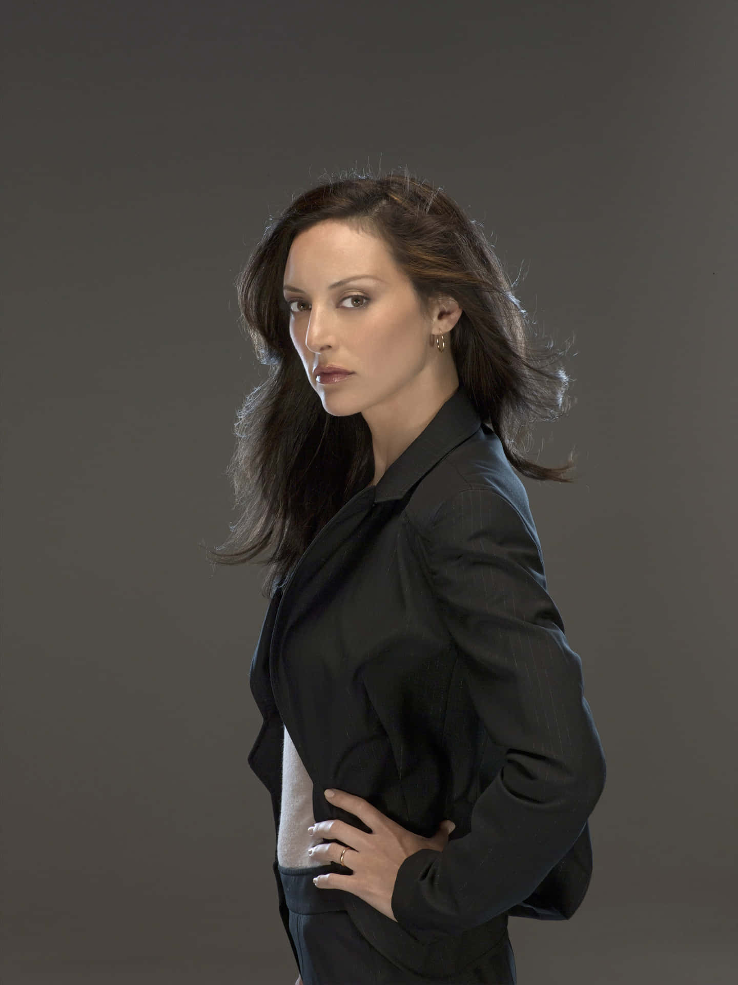 Paget Brewster Posing For A Portrait Background