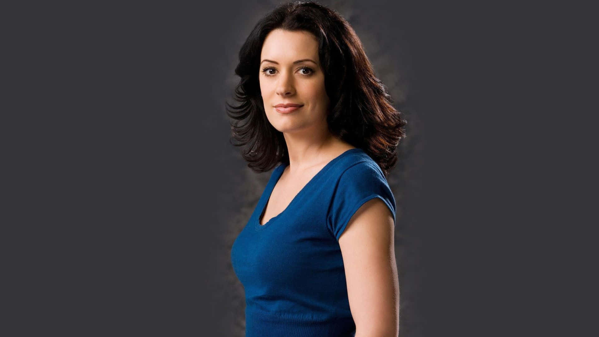 Paget Brewster Striking A Pose In A Stunning Photoshoot Background