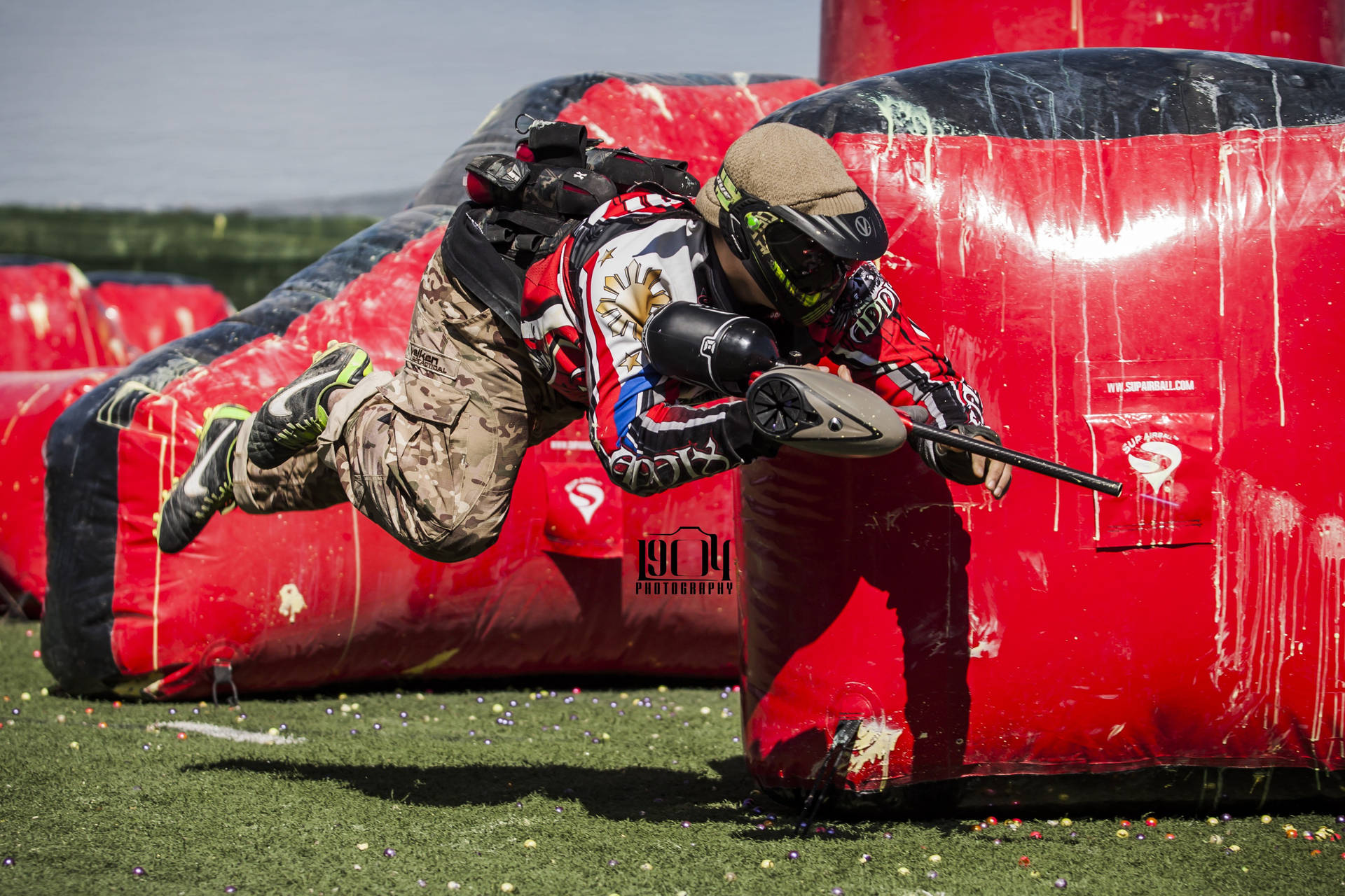 Paintball Player Ready For Action Background