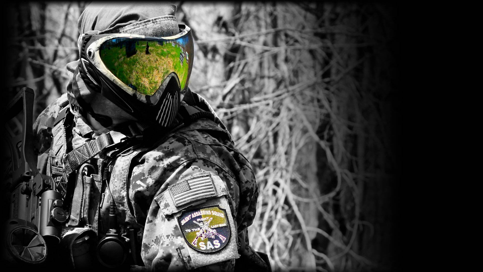 Paintball Pro Clad In Full Gear With Helmet During An Exciting Match.