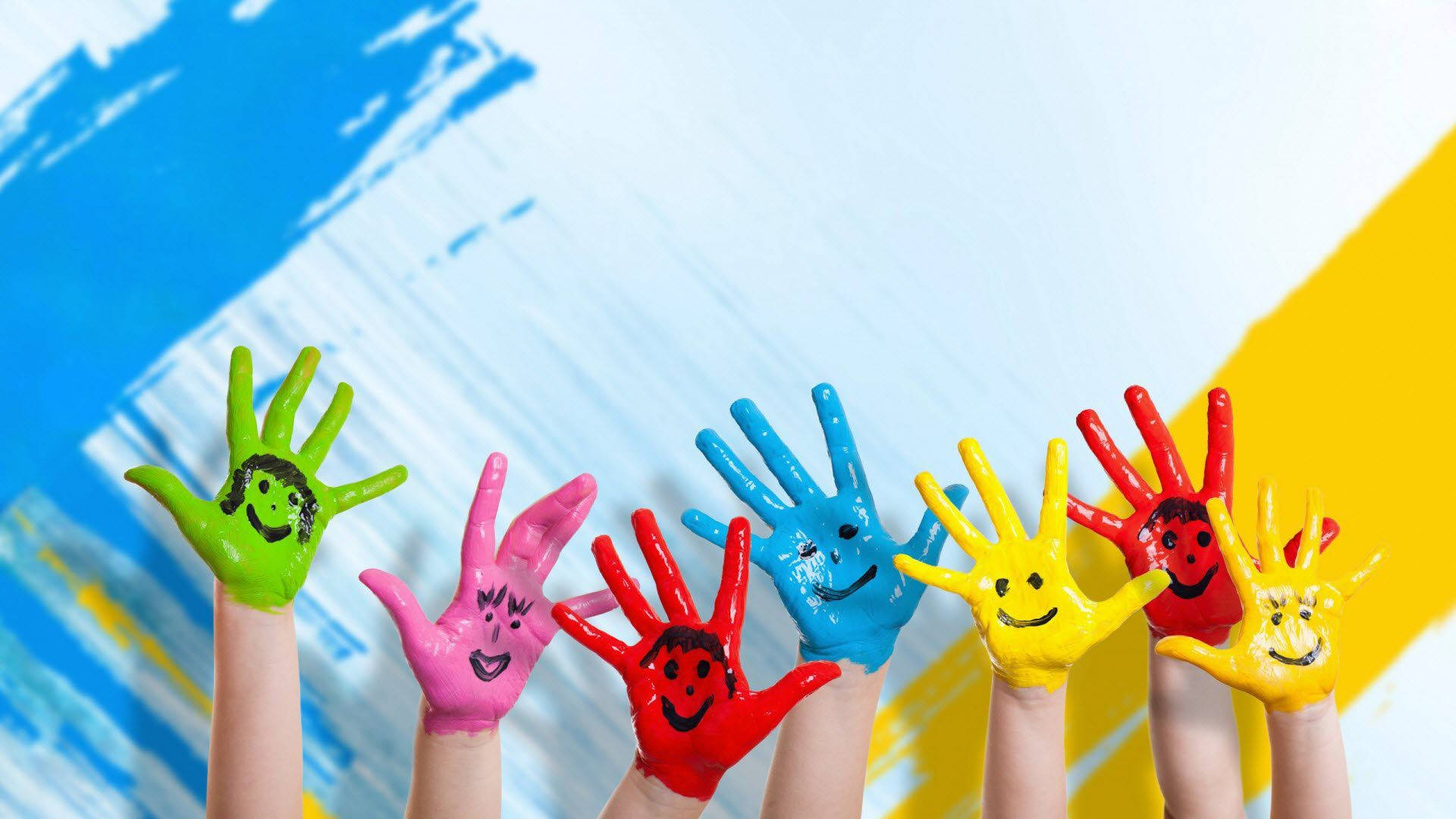 Painted Children's Hands With Happy Faces Background