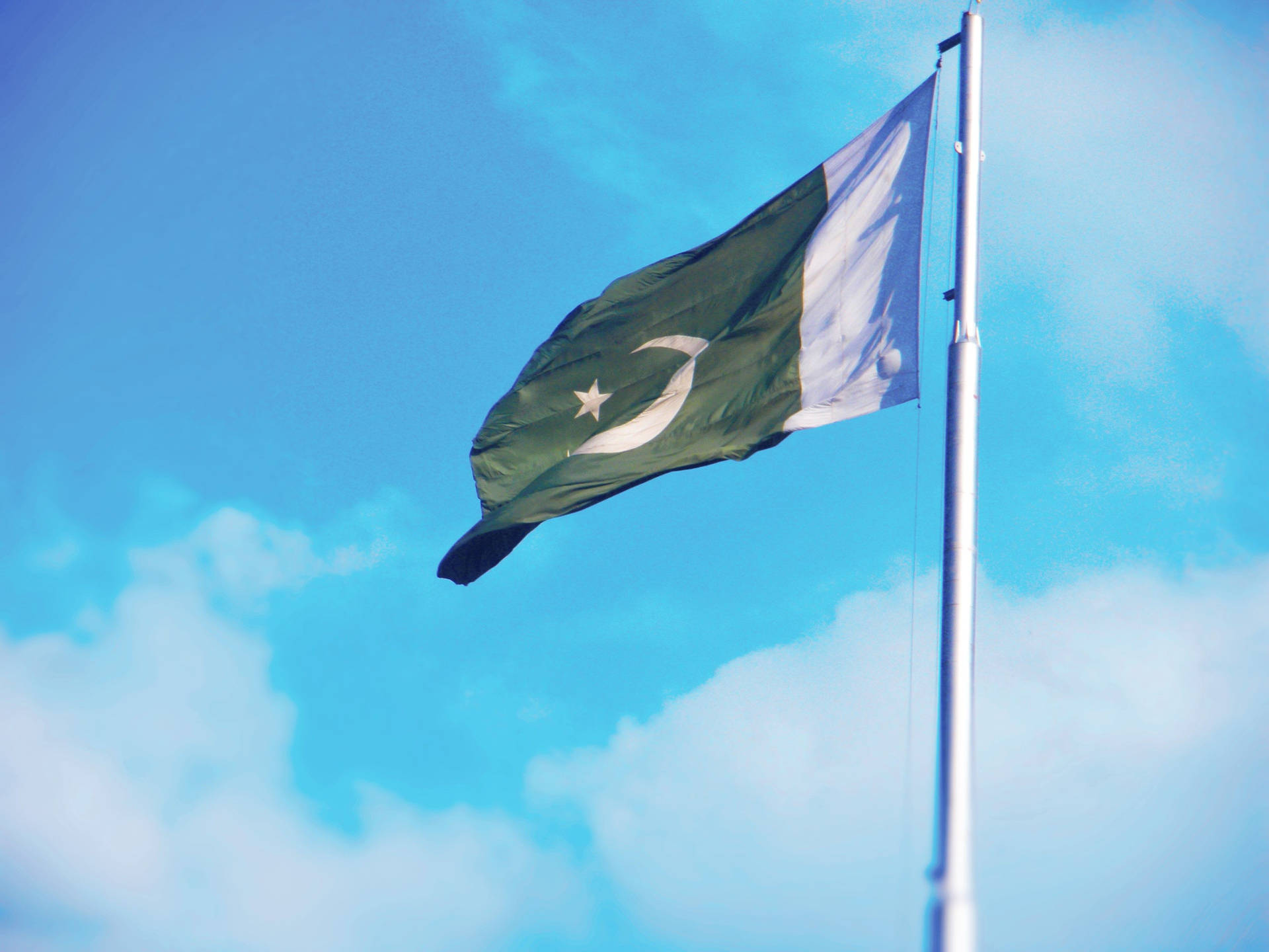 Pakistan Flag Blown By Wind Background