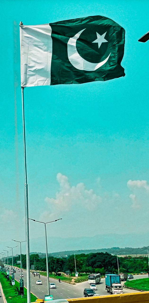 Pakistan Flag On Pole Background