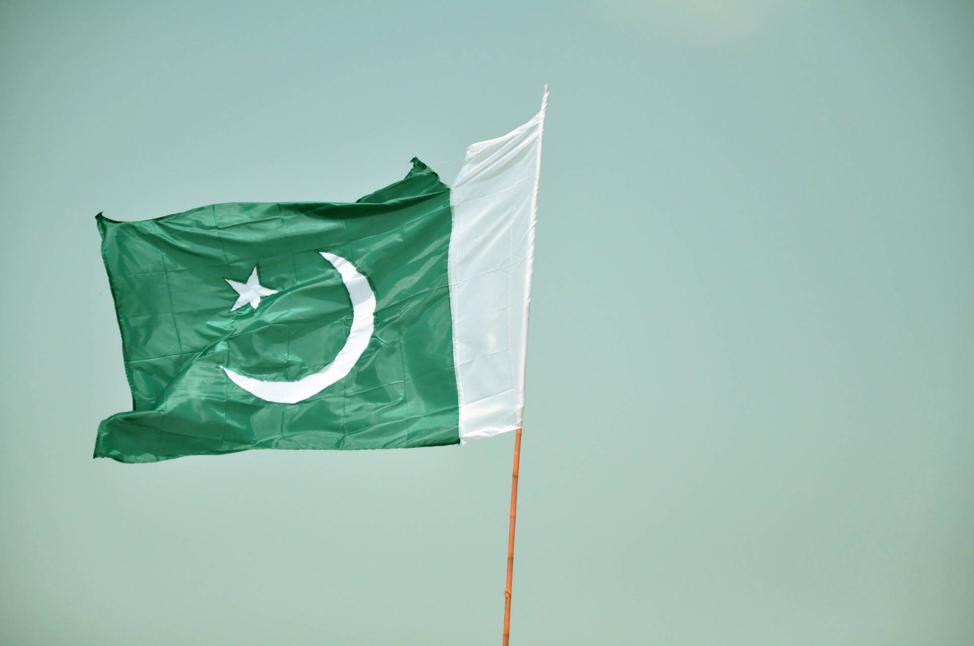 Pakistan Flag With Tear Background