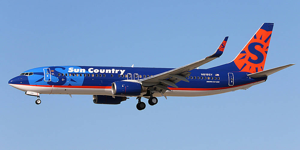 Pale Blue Sky Over A Sun Country Aircraft