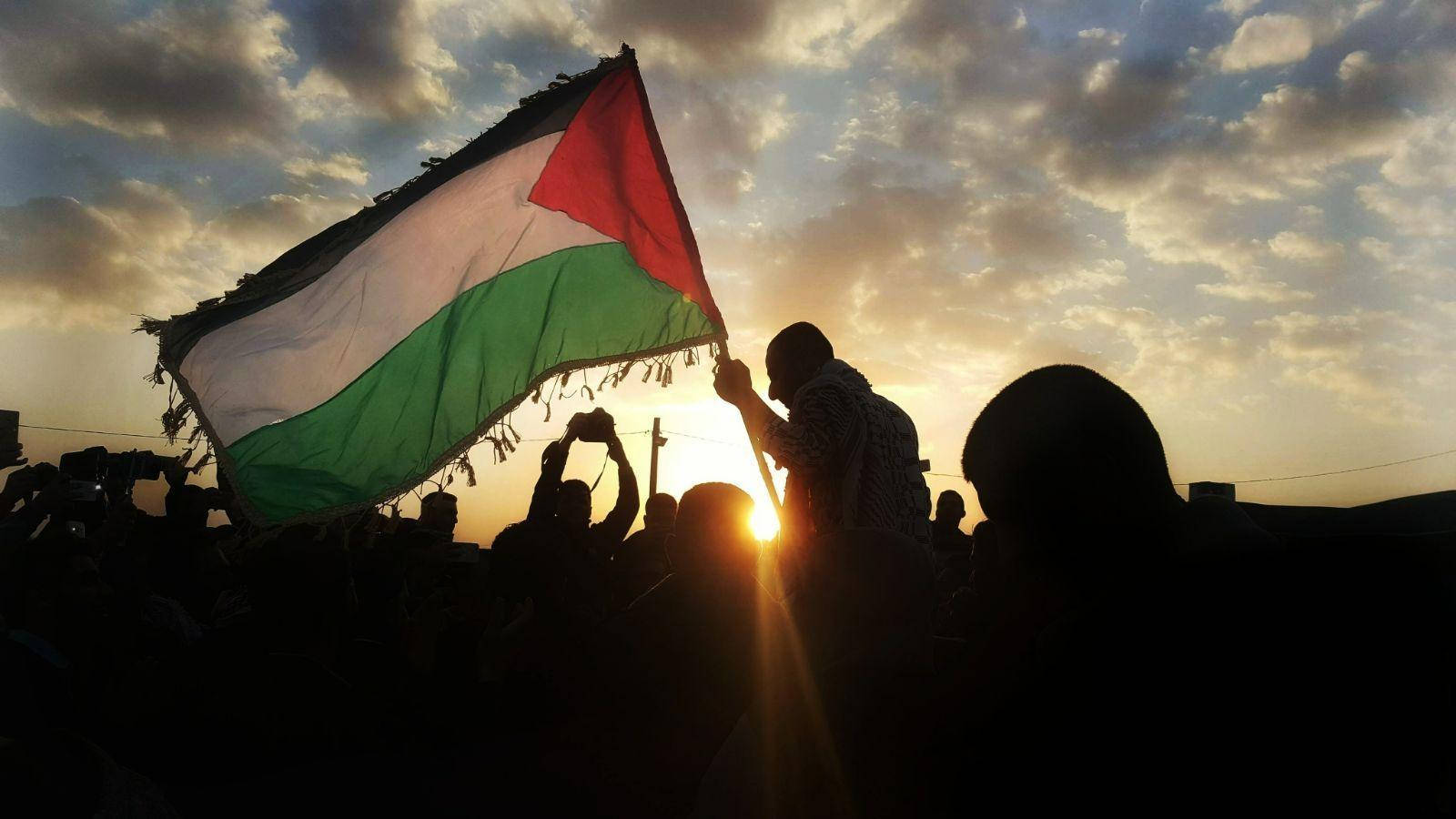 Palestine Flag Over Sunrise Background