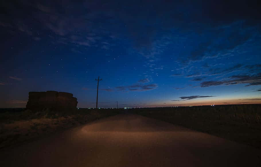 Palpable Calm On The Road At Night Background