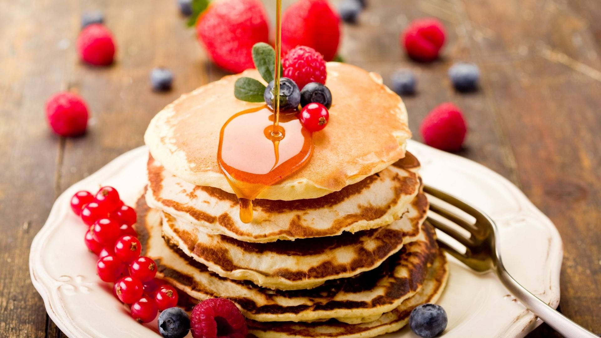 Pancakes With Blue And Red Berries Background