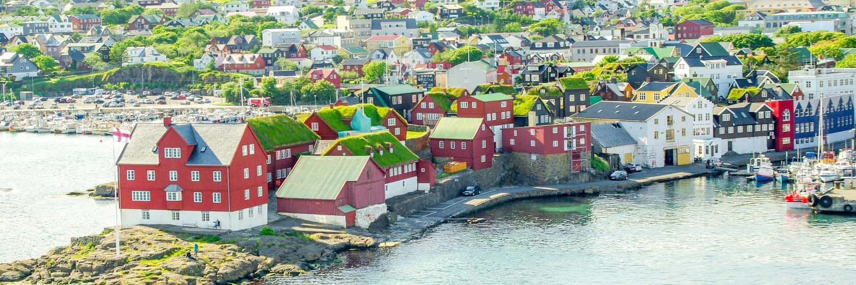 Panoramic View Of Thorshavn At Sunrise Background