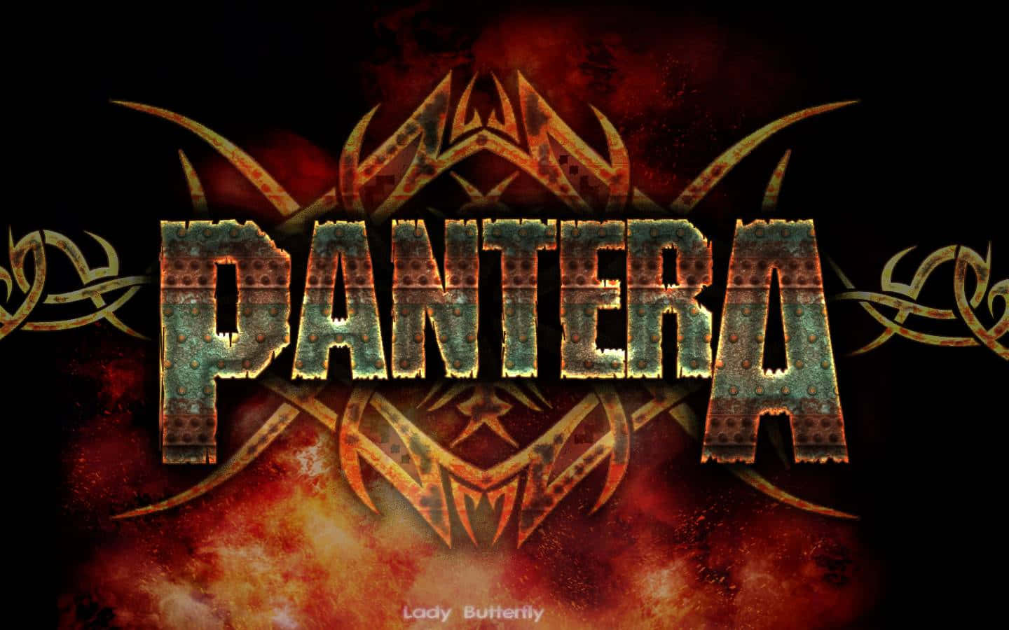 Pantera - A Logo With A Flame And A Skull Background