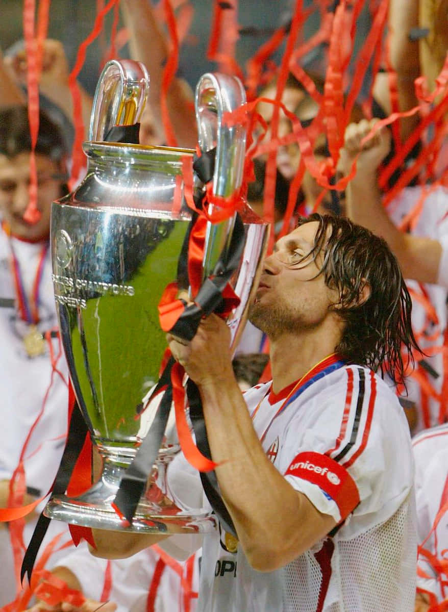 Paolo Maldini Kissing The Trophy Background