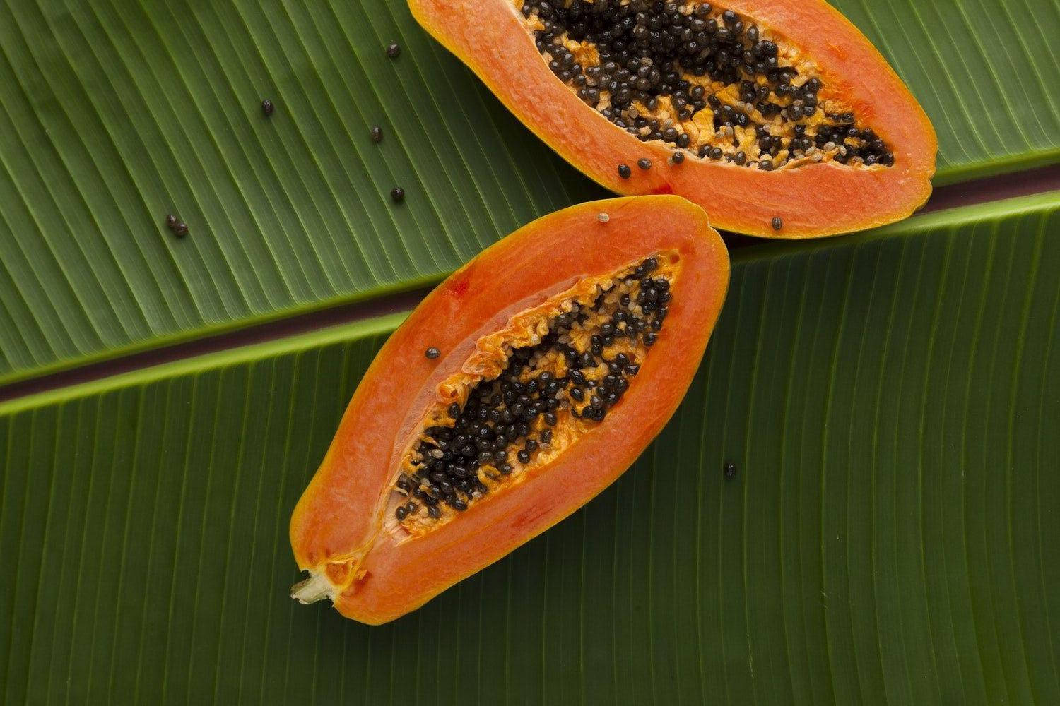 Papaya Fruits On Banana Leaf