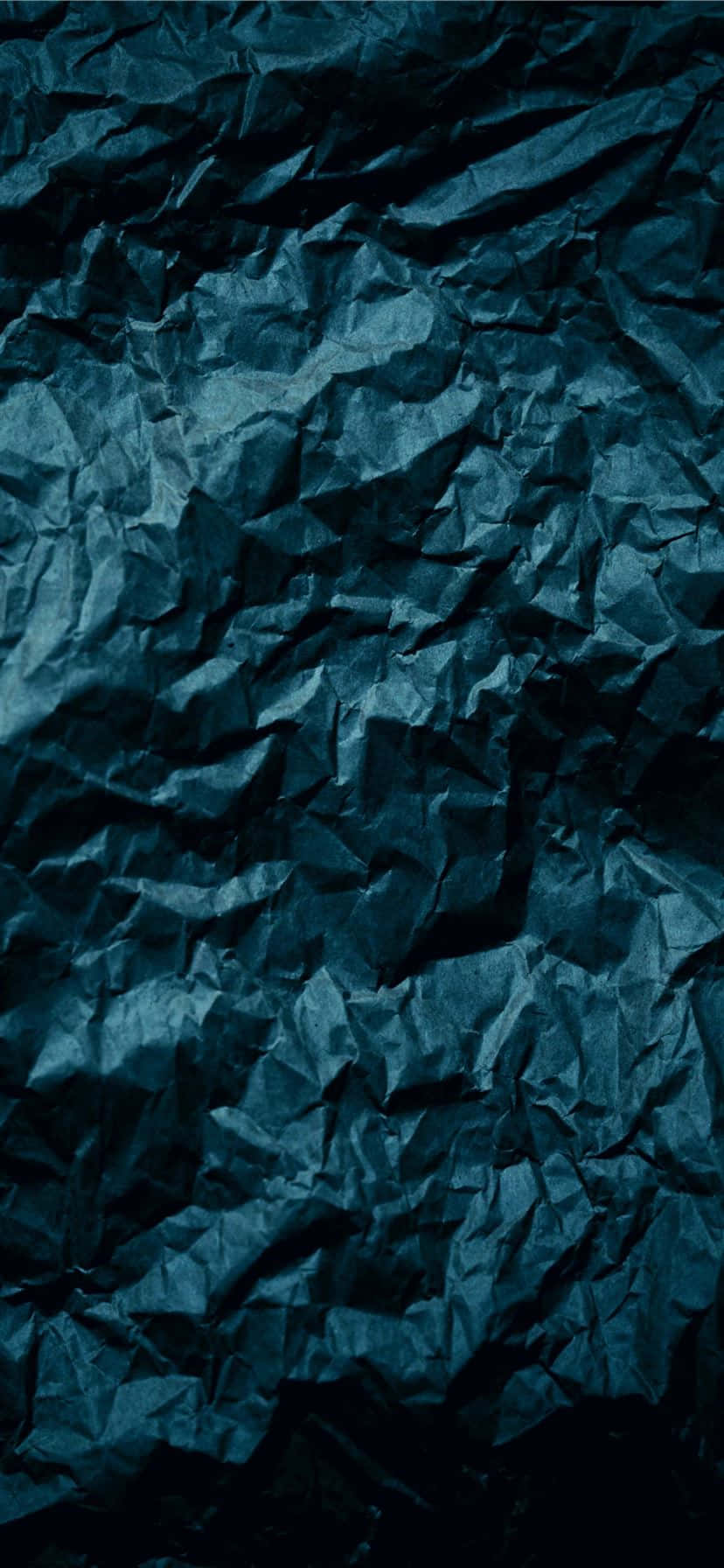 Paper Crumpled In Dark Blue Color Background