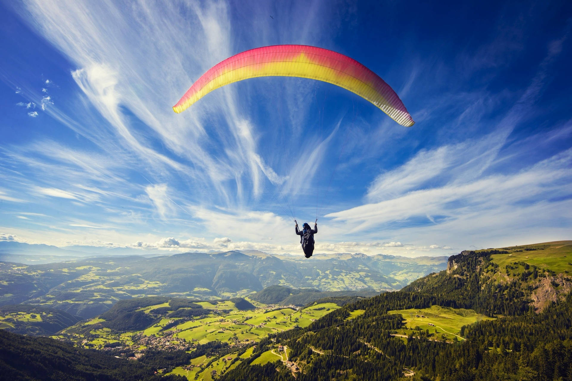 Paragliding Above Cliffs And Valleys
