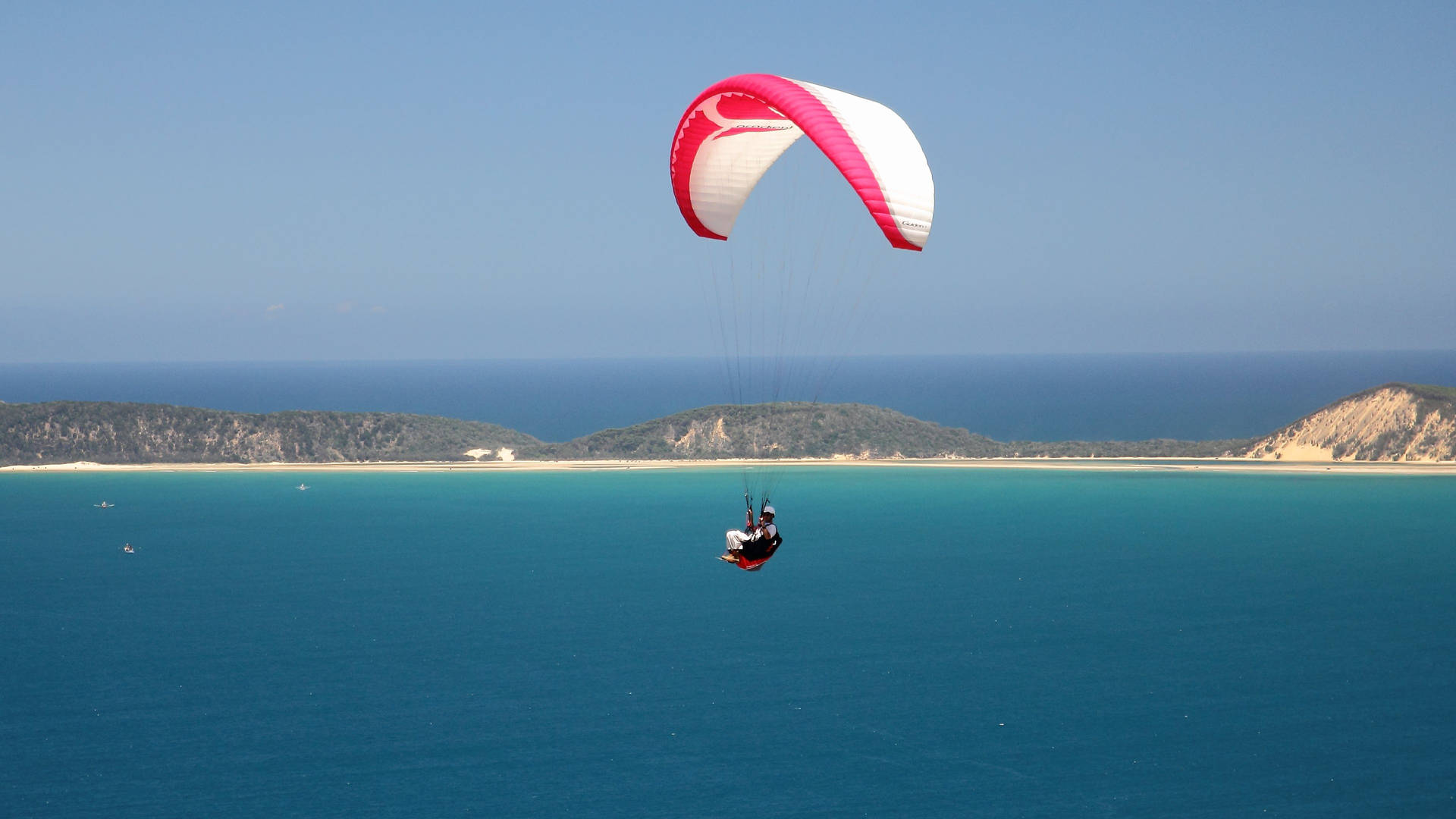 Paragliding Above Lagoon Background