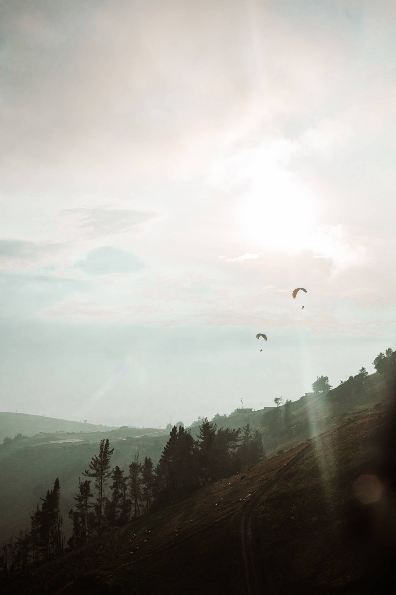Paragliding Above Mountain Slope