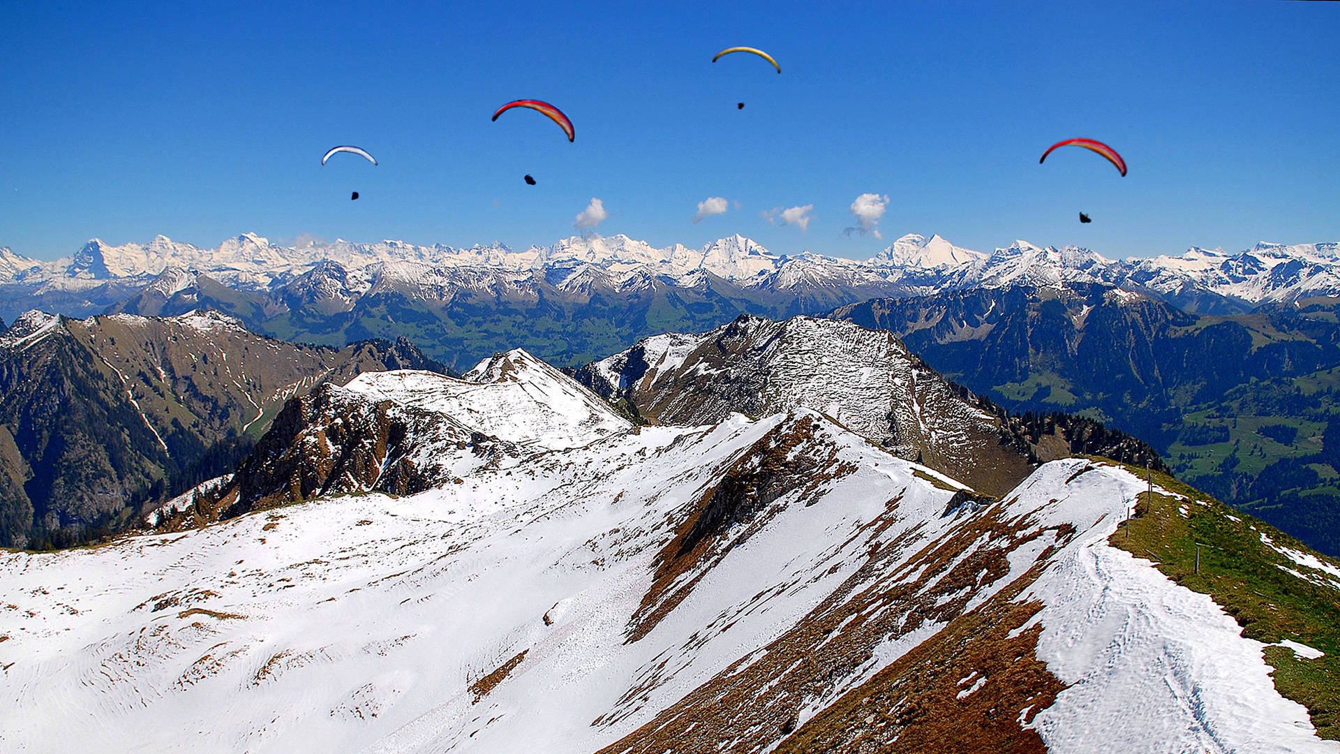 Paragliding Above Snow Mountains Background