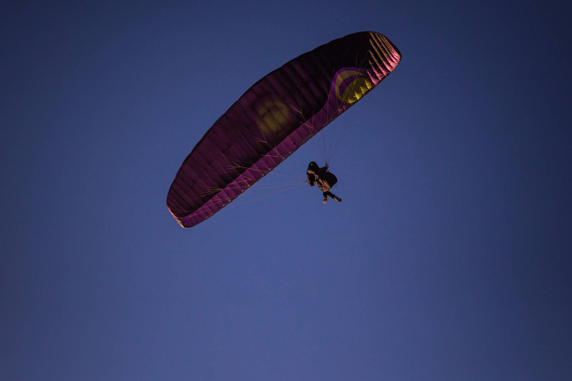 Paragliding In Dark Blue Sky Background