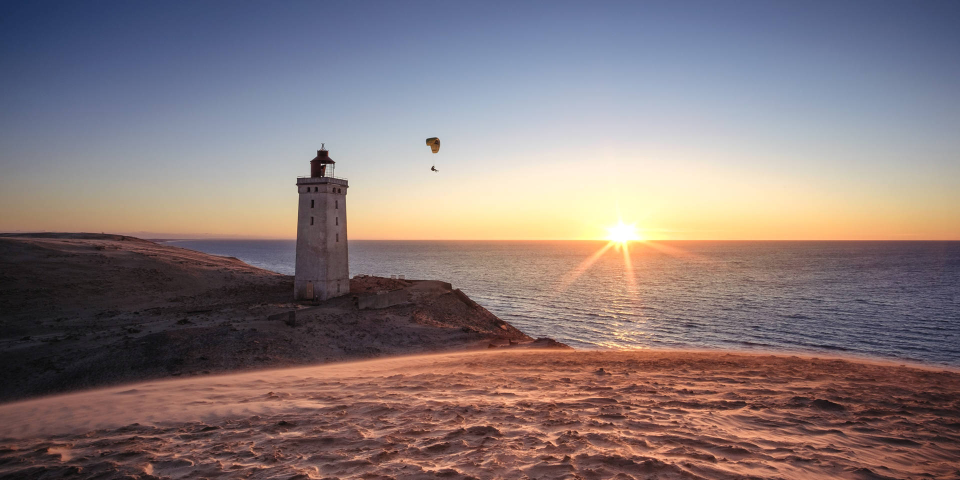 Paragliding Near Lighthouse Background