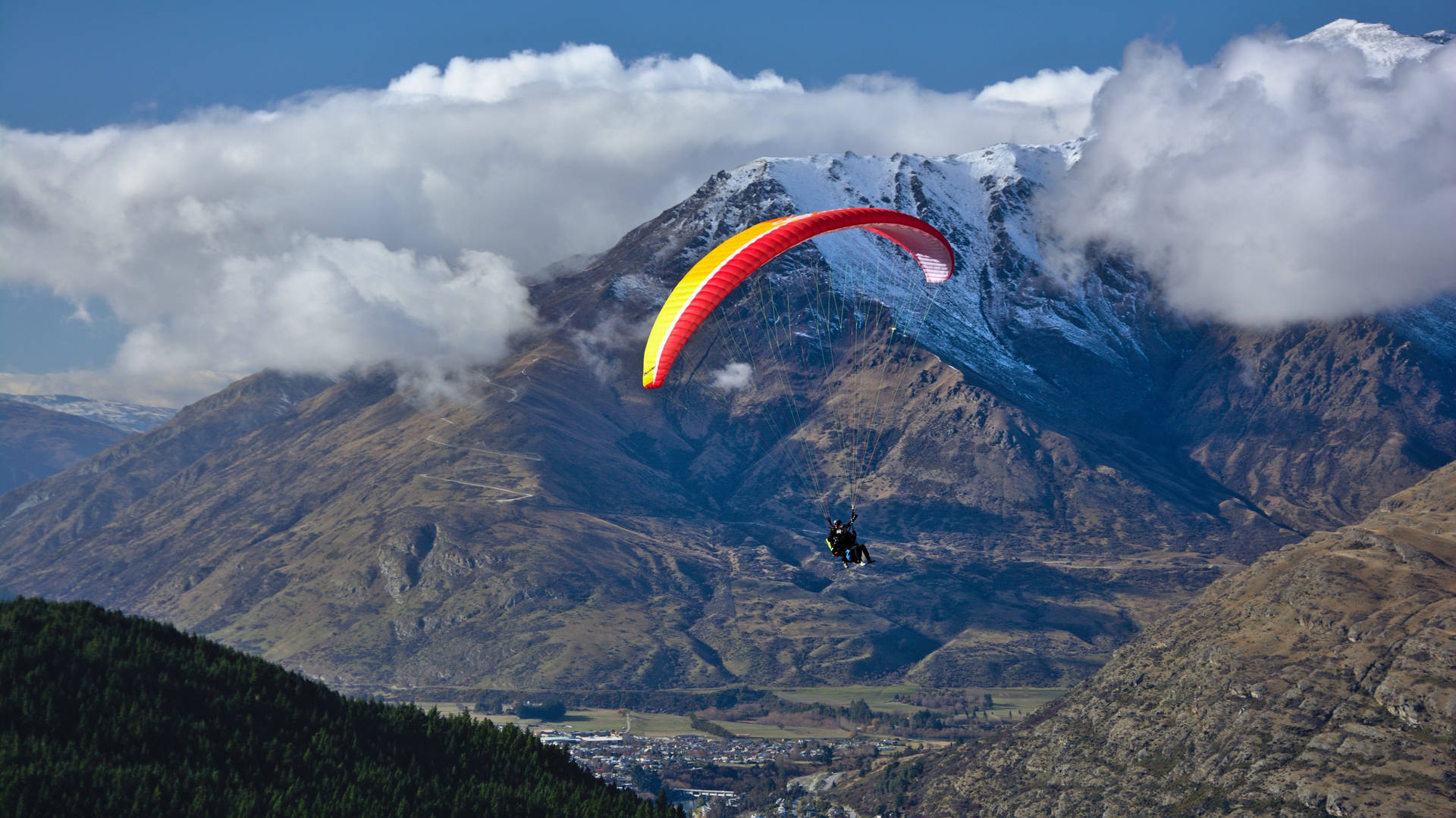 Paragliding Tandem Near Clouds Background