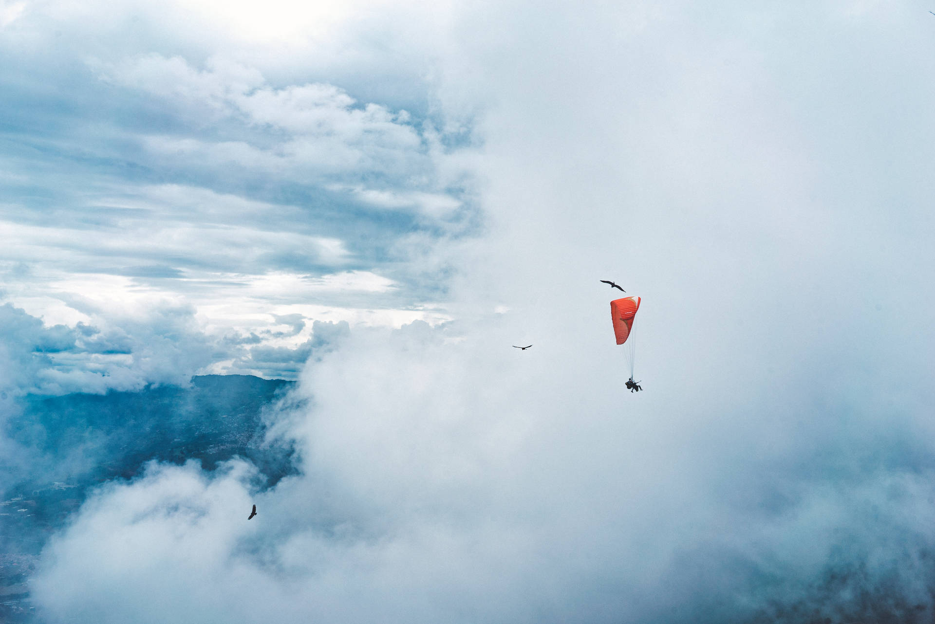 Paragliding Through Clouds Background