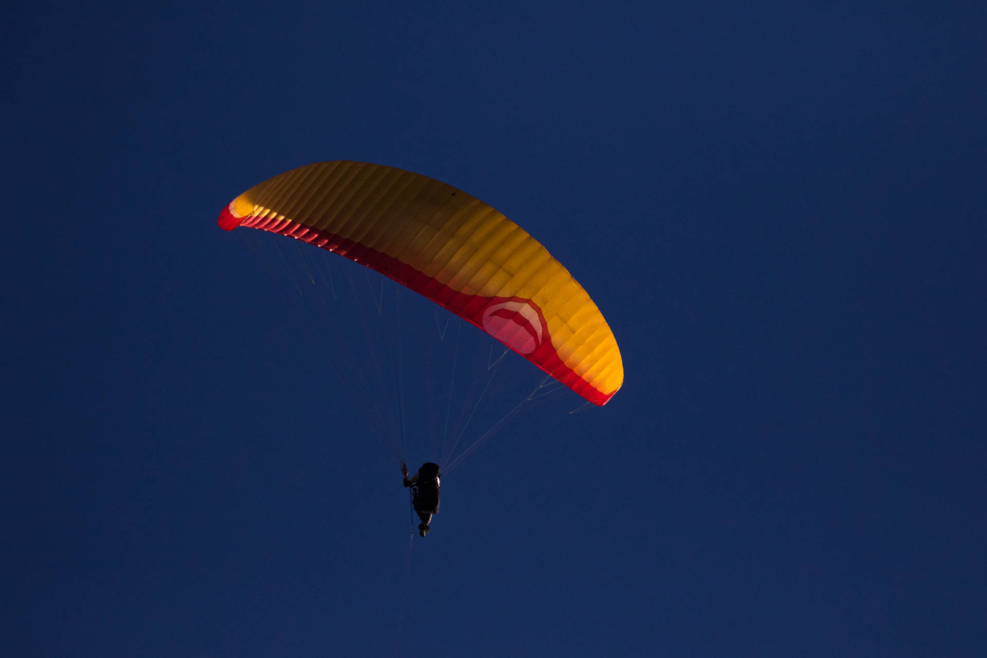 Paragliding Under Night Sky Background