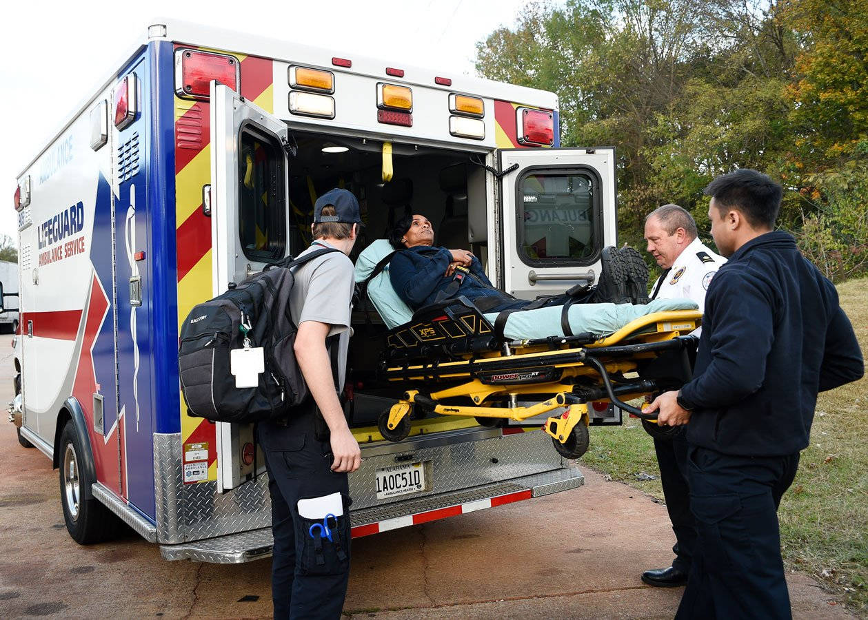 Paramedic Boarding A Patient Background