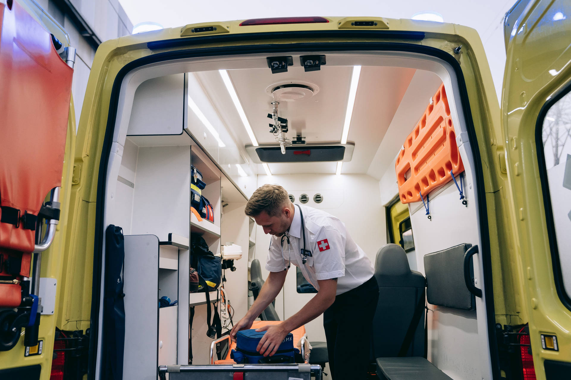 Paramedic Man Fixing Equipments Background