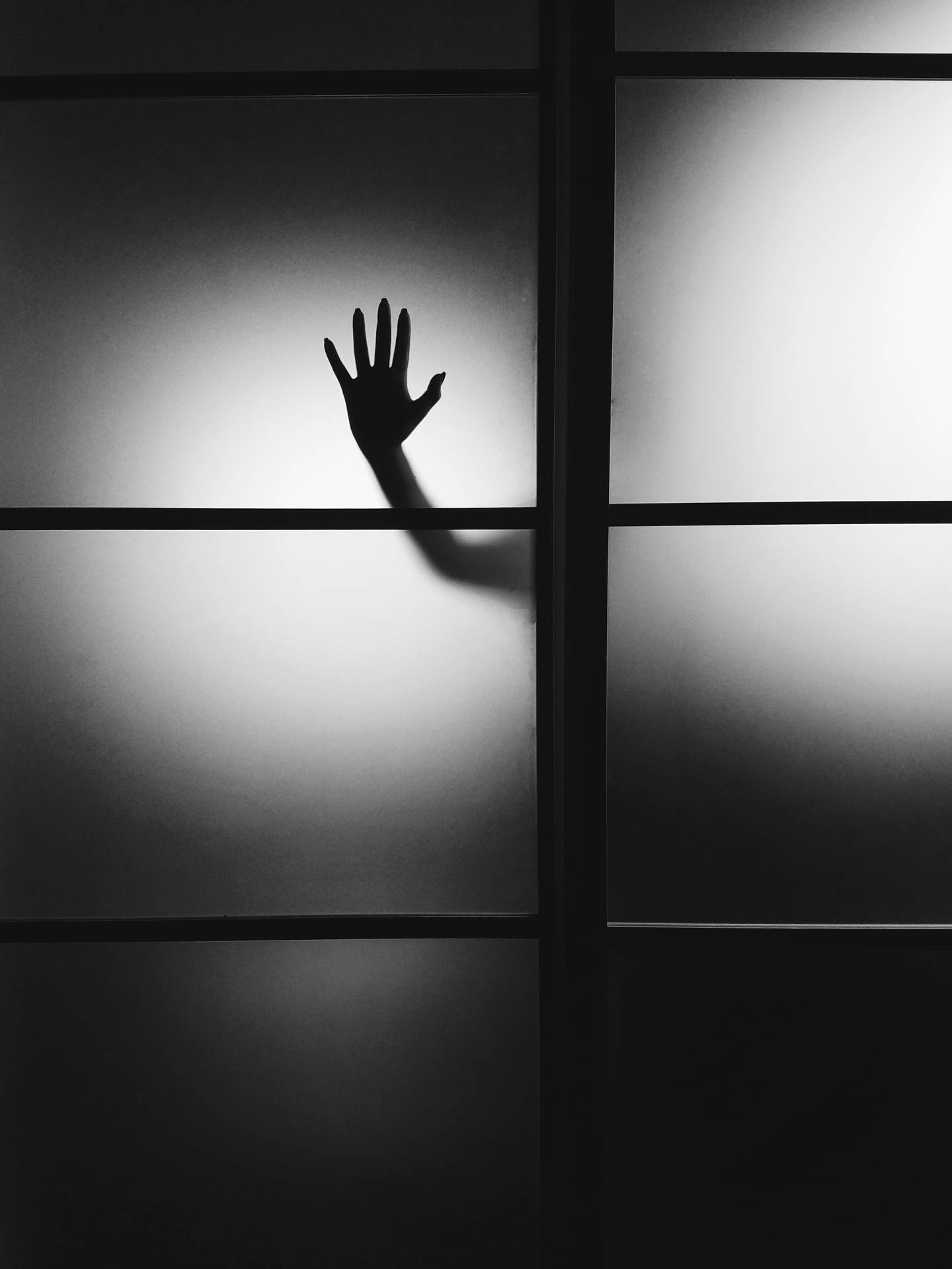 Paranormal Hand On Glass Wall Background