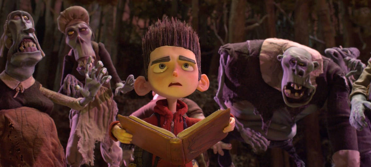 Paranorman's Norman Engrossed In Reading An Enchanting Book Background