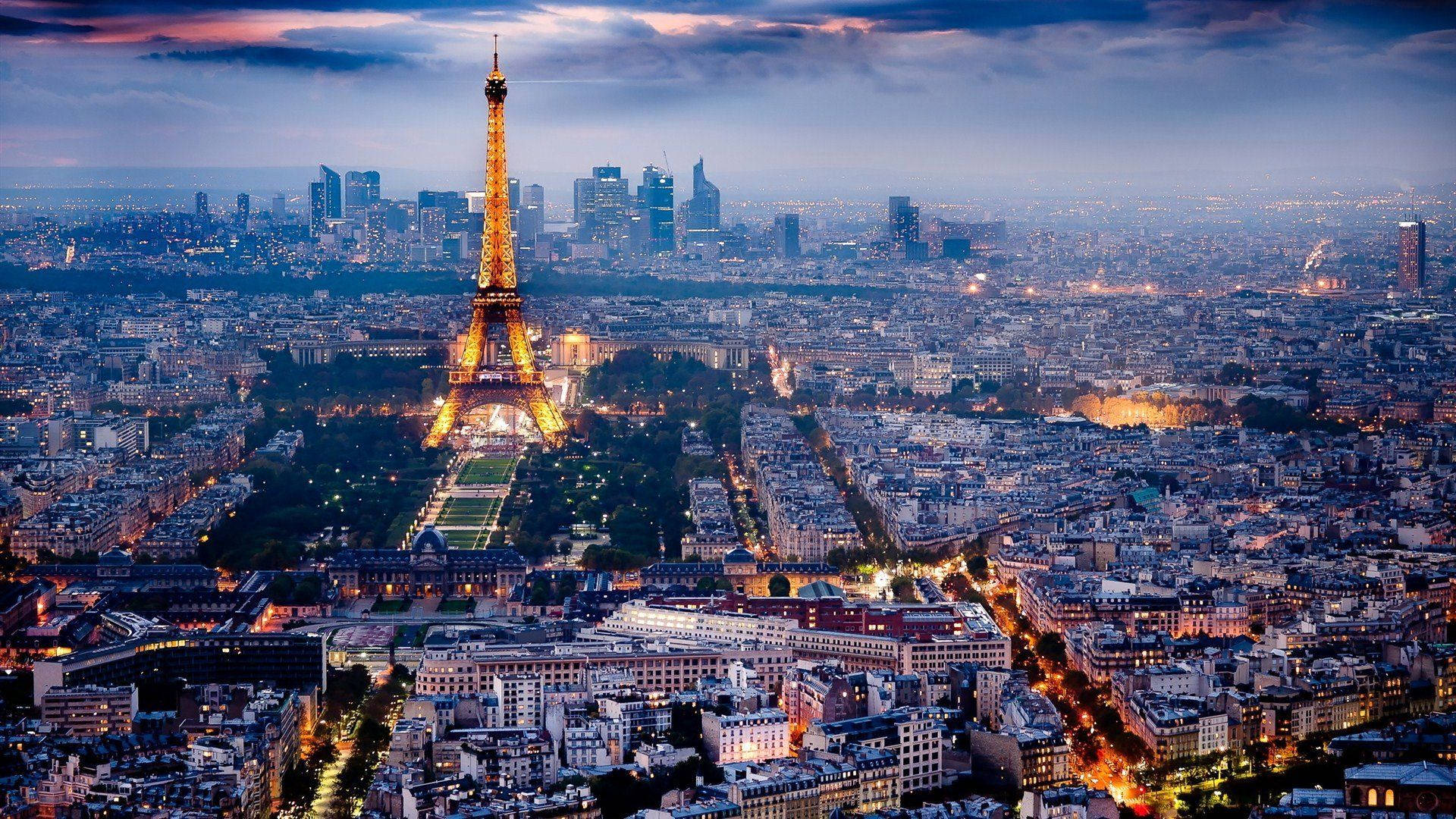 Paris At Dusk With The Eiffel Tower In The Background Background