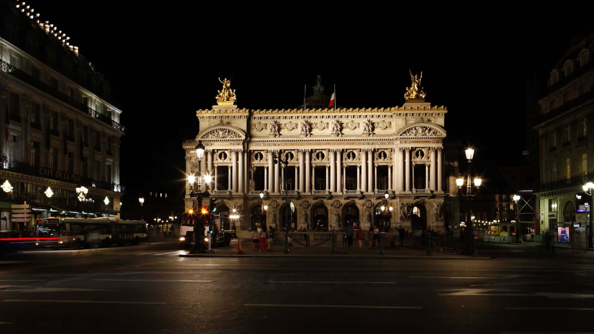 Paris Opera House Gleaming Under The Night Sky Background