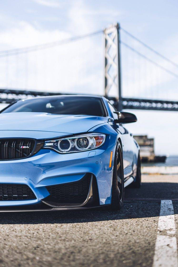 Parked Blue Bmw With Bridge View Background