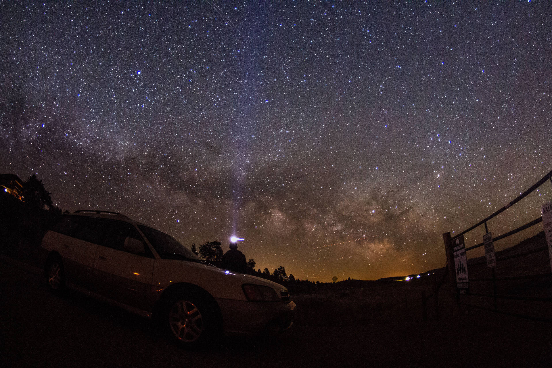 Parked Car And Starry Night Background
