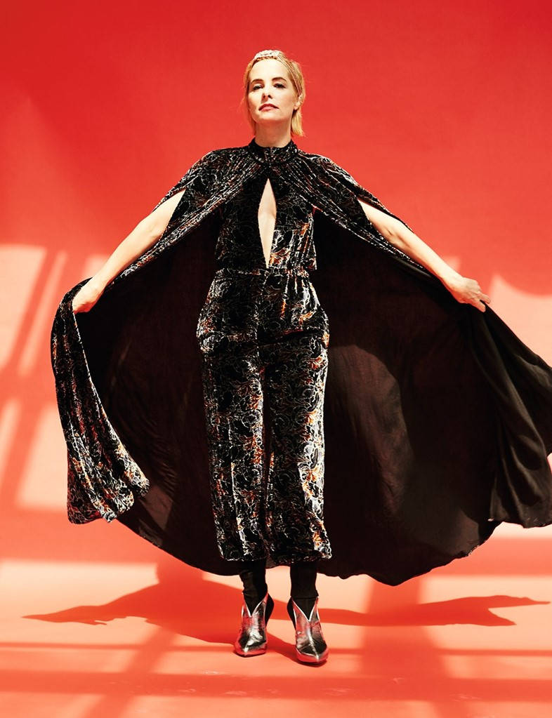 Parker Posey Wearing A Cape Background