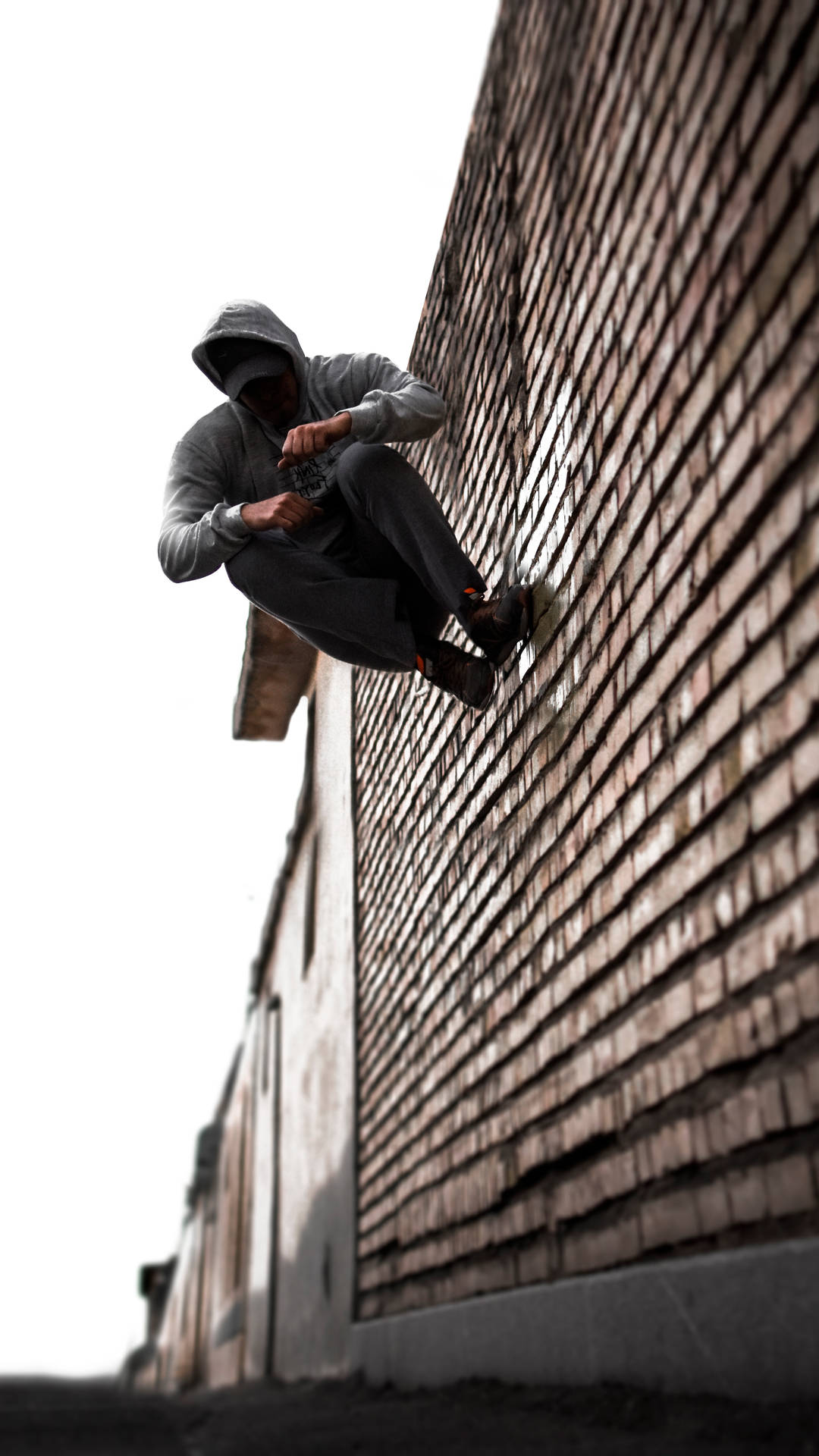 Parkour Stunt On Brick Wall Background