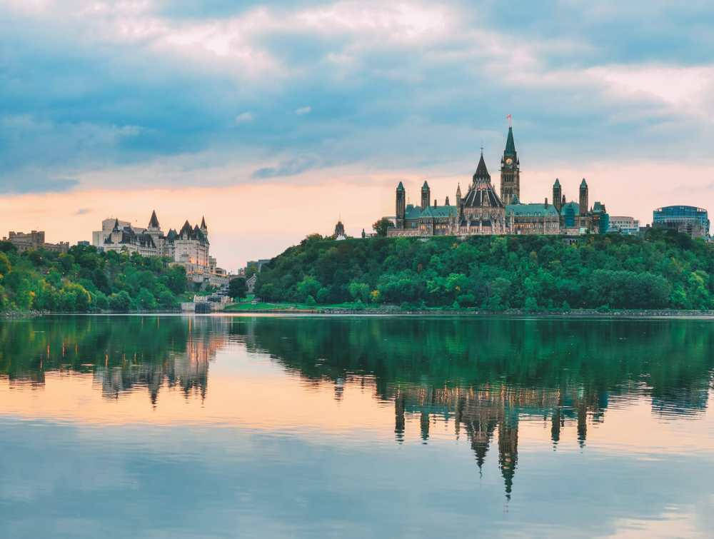 Parliament Hill's Reflection In Ottawa River