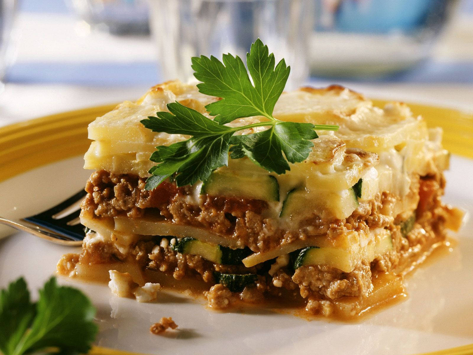 Parsley Leaf Over A Cakey Moussaka Background