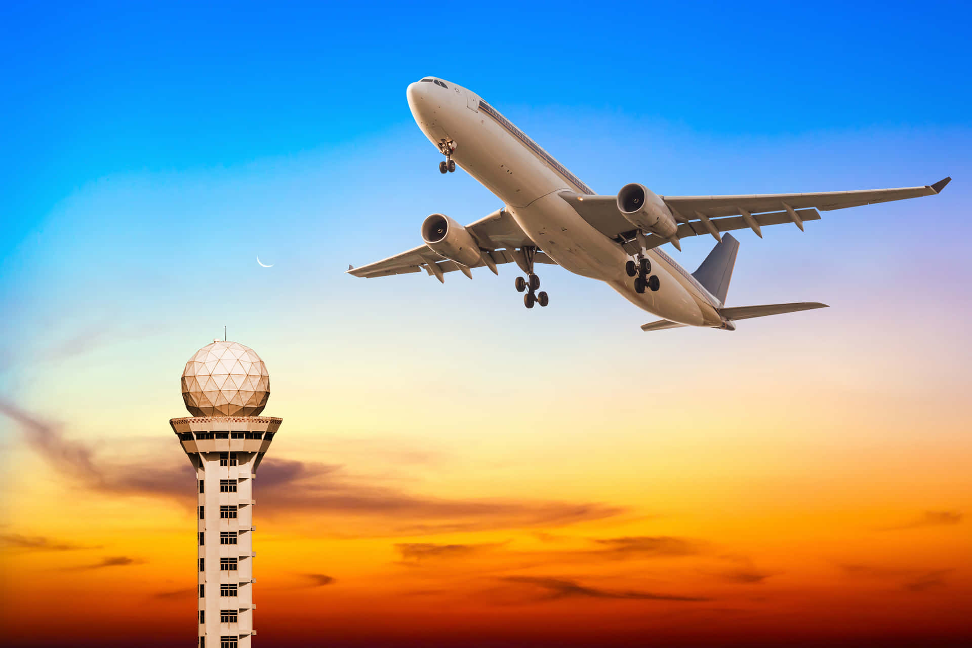 Passenger Aircraft Taking Off Into The Sunset Background